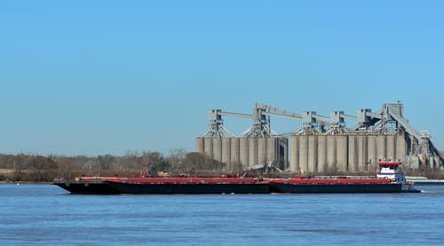 Tug Pushing Barge On Mississippi River