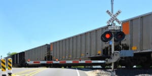 Whenever any person driving a vehicle approaches a railroad grade crossing under any of the circumstances stated in this section, the driver of such vehicle shall stop not less than 15 feet from the nearest rail of such railroad and shall not proceed until he can do so safely.